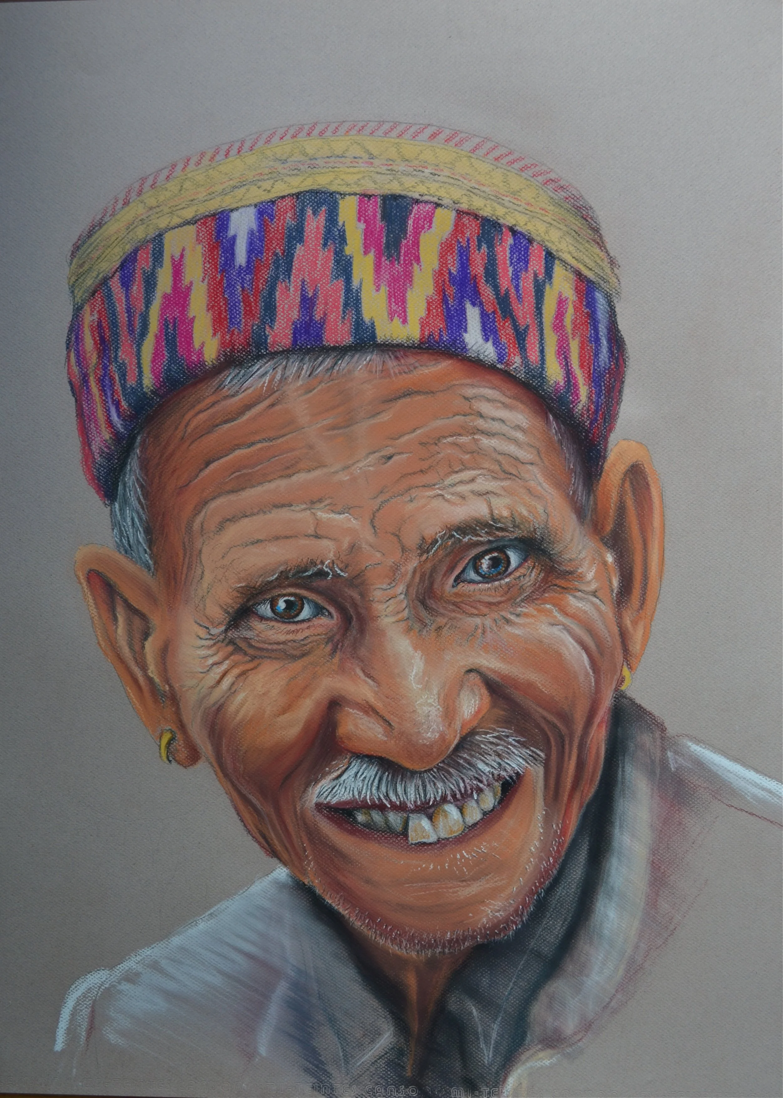 A portrait of an elderly man with light skin, deep wrinkles, blue eyes, a white mustache, and a big smile showing gaps in his teeth. He is wearing a colorful patterned cap and a white shirt.
