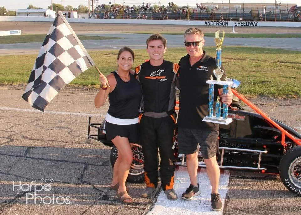 Landon Brown with dad Phil Brown and mom Sonya Lentini celebrating in victory lane at Salem Speedway Kenyon Midget Series