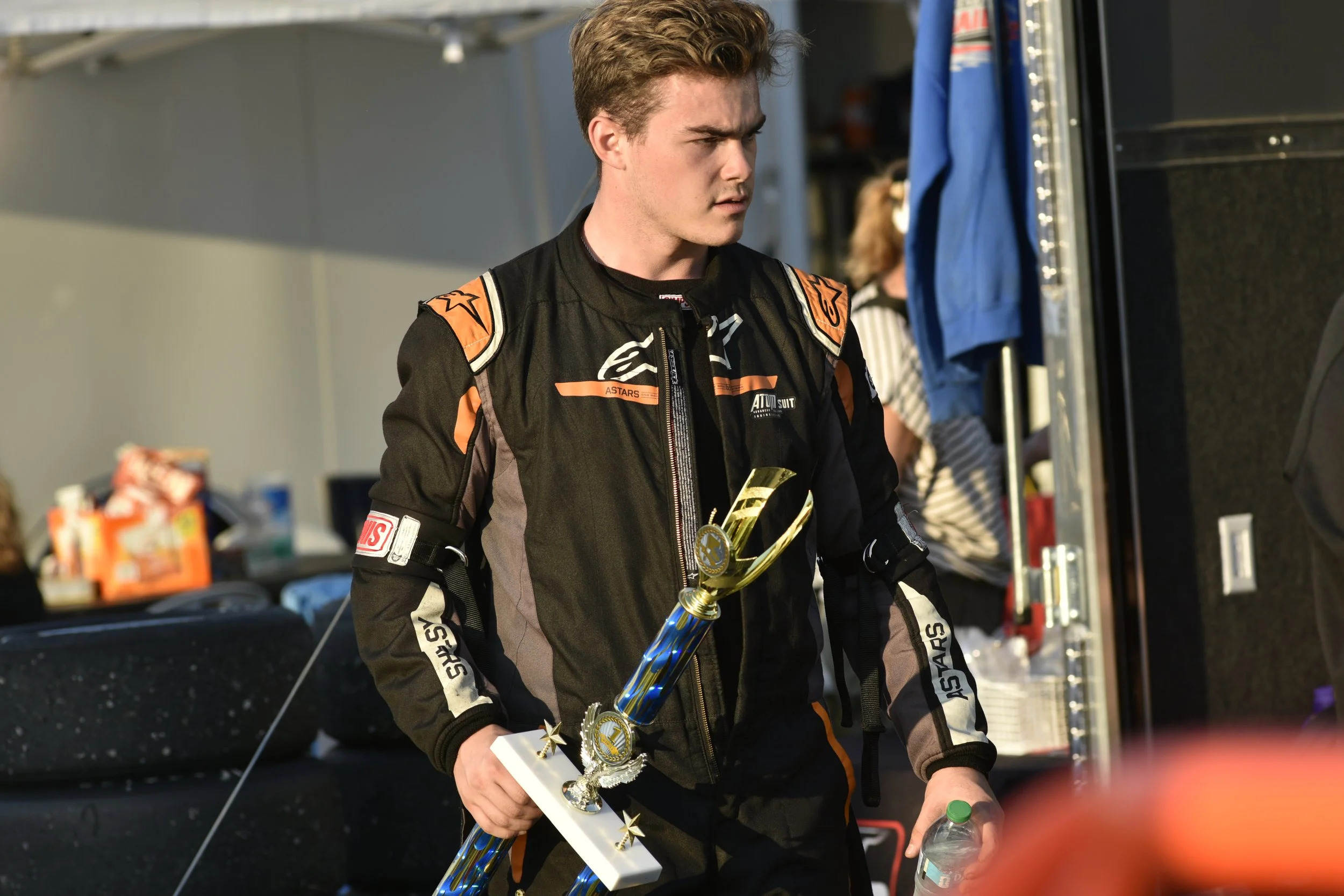 Landon Brown holding the winners trophy in the Kenyon Midget Series