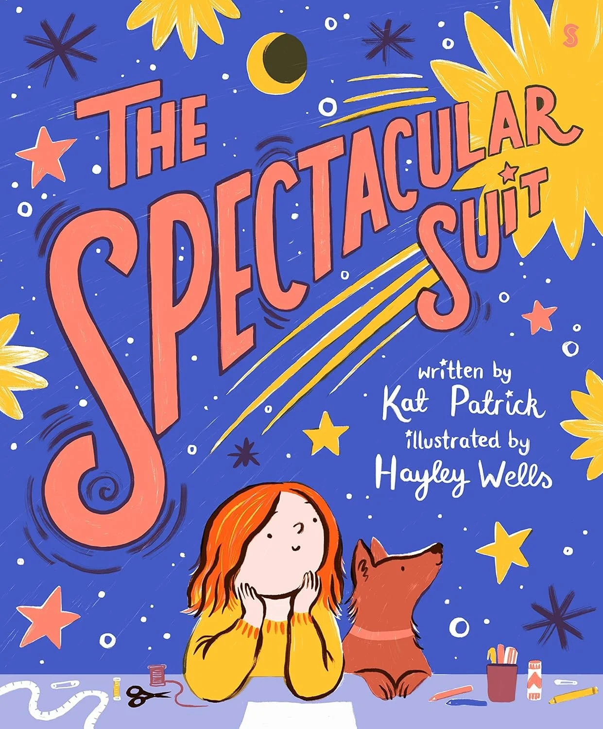 Cover of a children's book titled 'The Spectacular Suit' by Kat Patrick, illustrated by Hayley Wells. The illustration features a girl with orange hair and a yellow sweater sitting at a desk with a dog beside her, surrounded by colorful stars, moons,