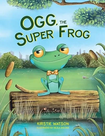 Book cover of "Ogg the Super Frog" by Kirstie Watson, illustrated by Melja Shodja, featuring a cartoon frog with a bow tie sitting on a log in a lush outdoor setting.