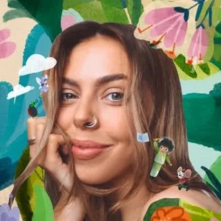 A young woman with a nose ring and long hair taking a selfie in front of a colorful, cartoon-style background with animals, lush greenery, and flowers.