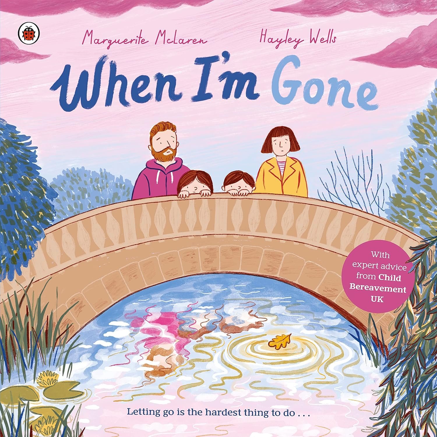 Book cover illustration for "When I'm Gone" by Marguerite McLaren and Hayley Wells, depicting a family of four looking over a body of water from a bridge, with trees and pink sky in the background.