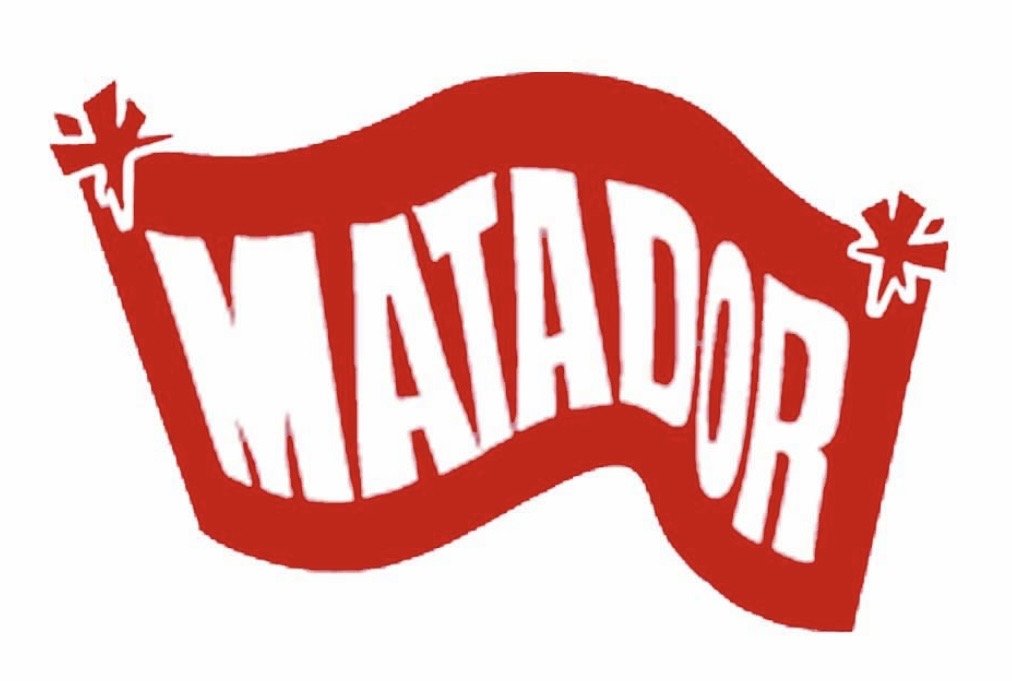 Red wavy banner with the word "MATADOR" in white, stylized lettering, and decorative elements at the ends.