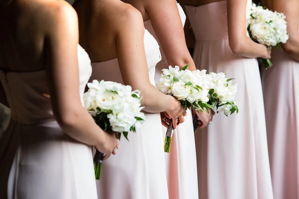 bridesmaids holding bouquets