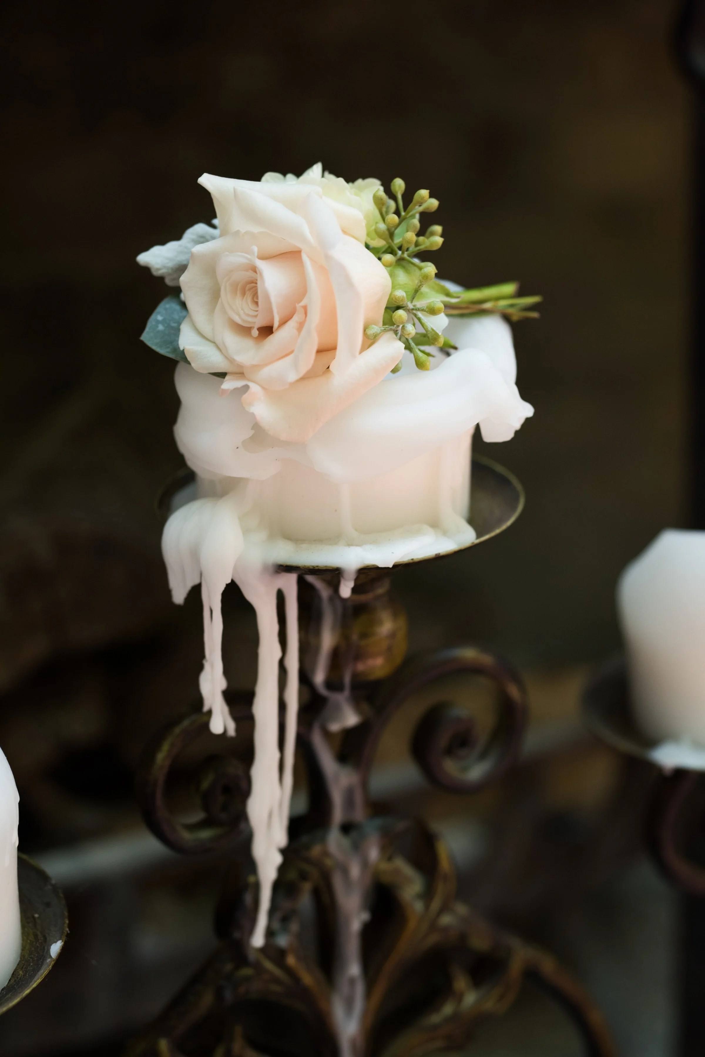 candle on stand with rose