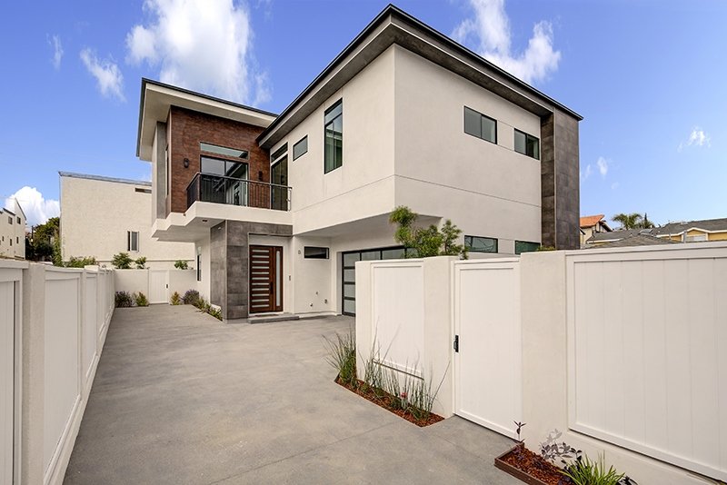 Side Entrance Luxury Custom Home In Malibu by AY Builders with Luxury Finishes