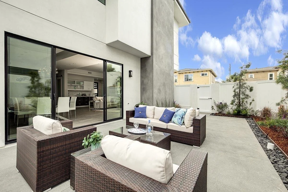 Back Yard Luxury Custom Home In Malibu by AY Builders with Luxury Finishes