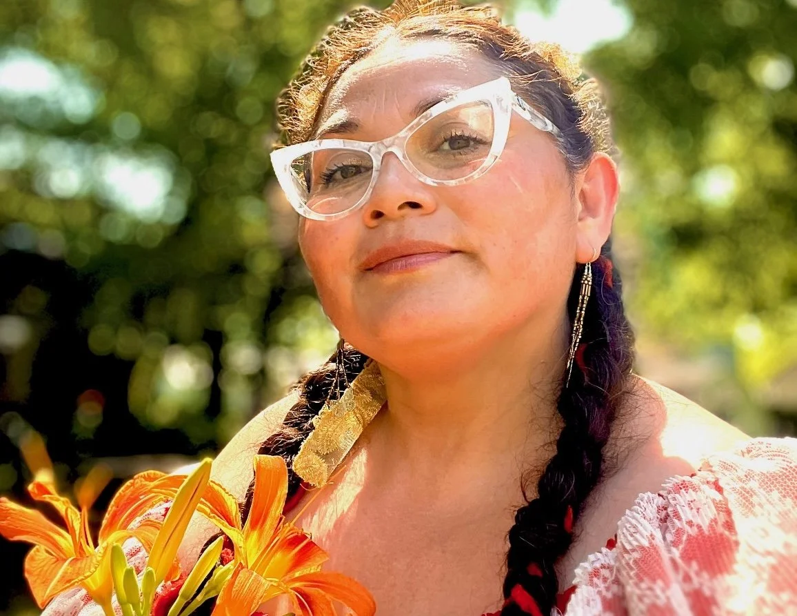 Miriam Alarcón Avila, outdoors with orange lilies