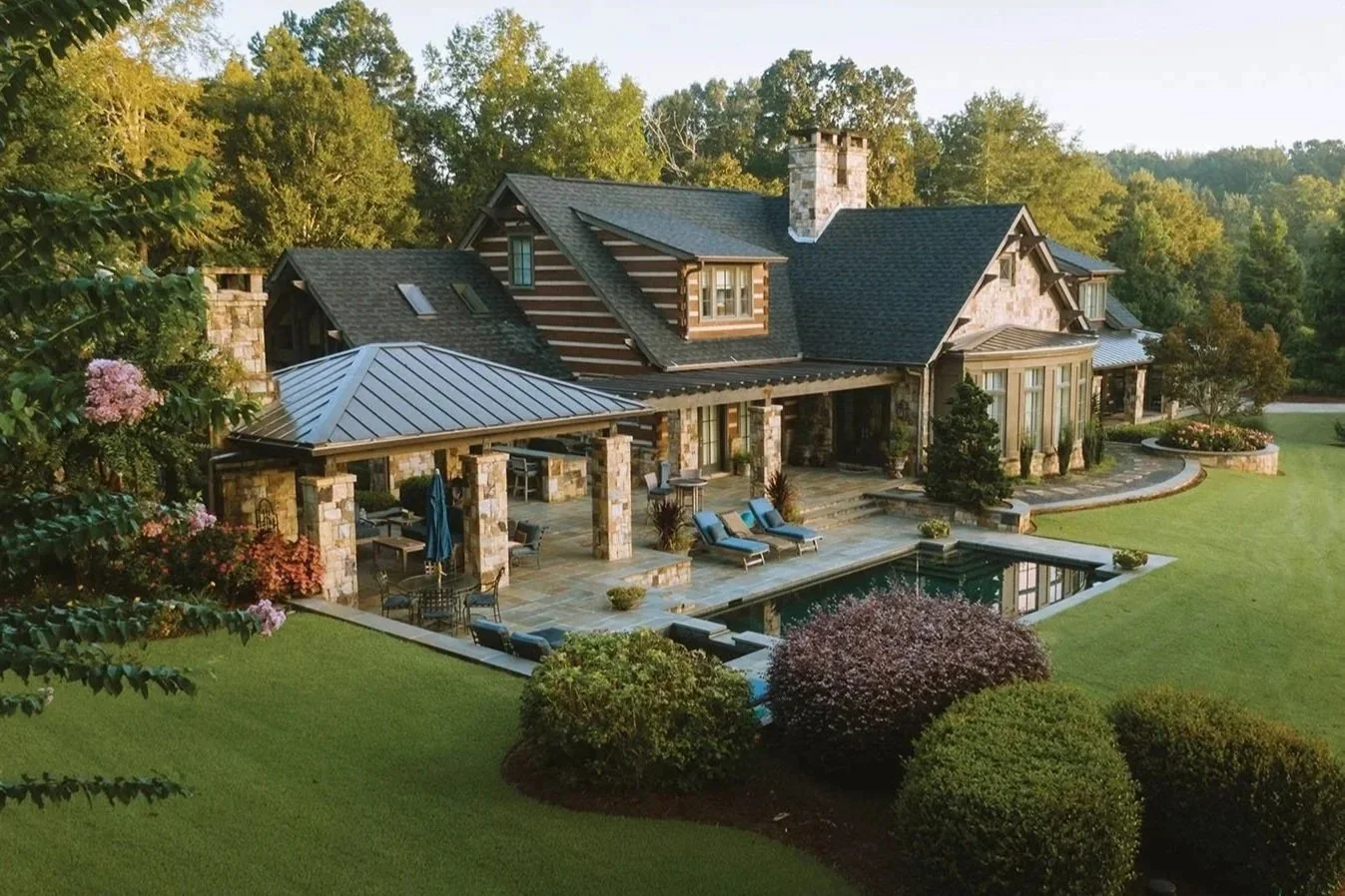 Above view of stone house with pool