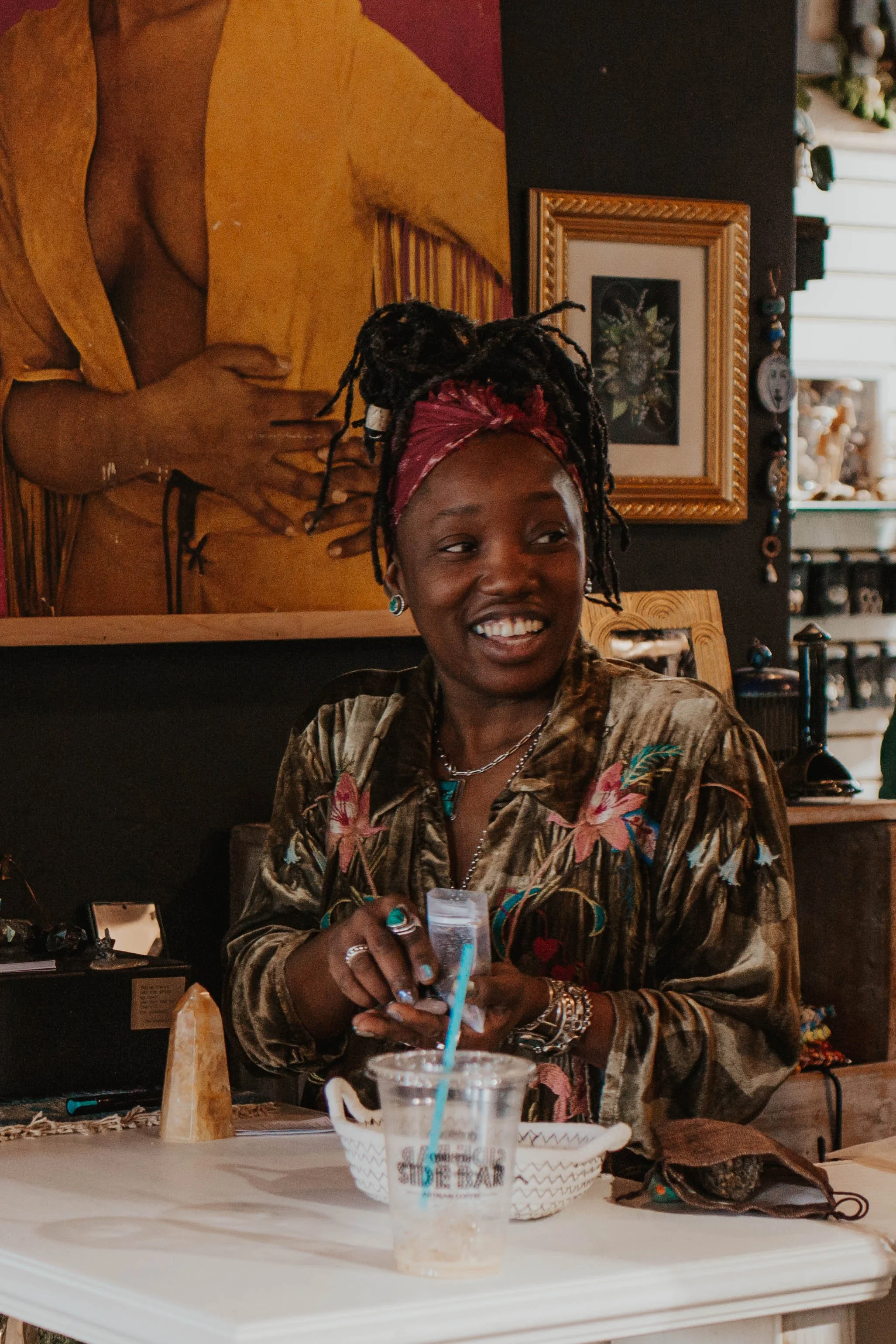 Koko at Mirthy register smiling with a customer