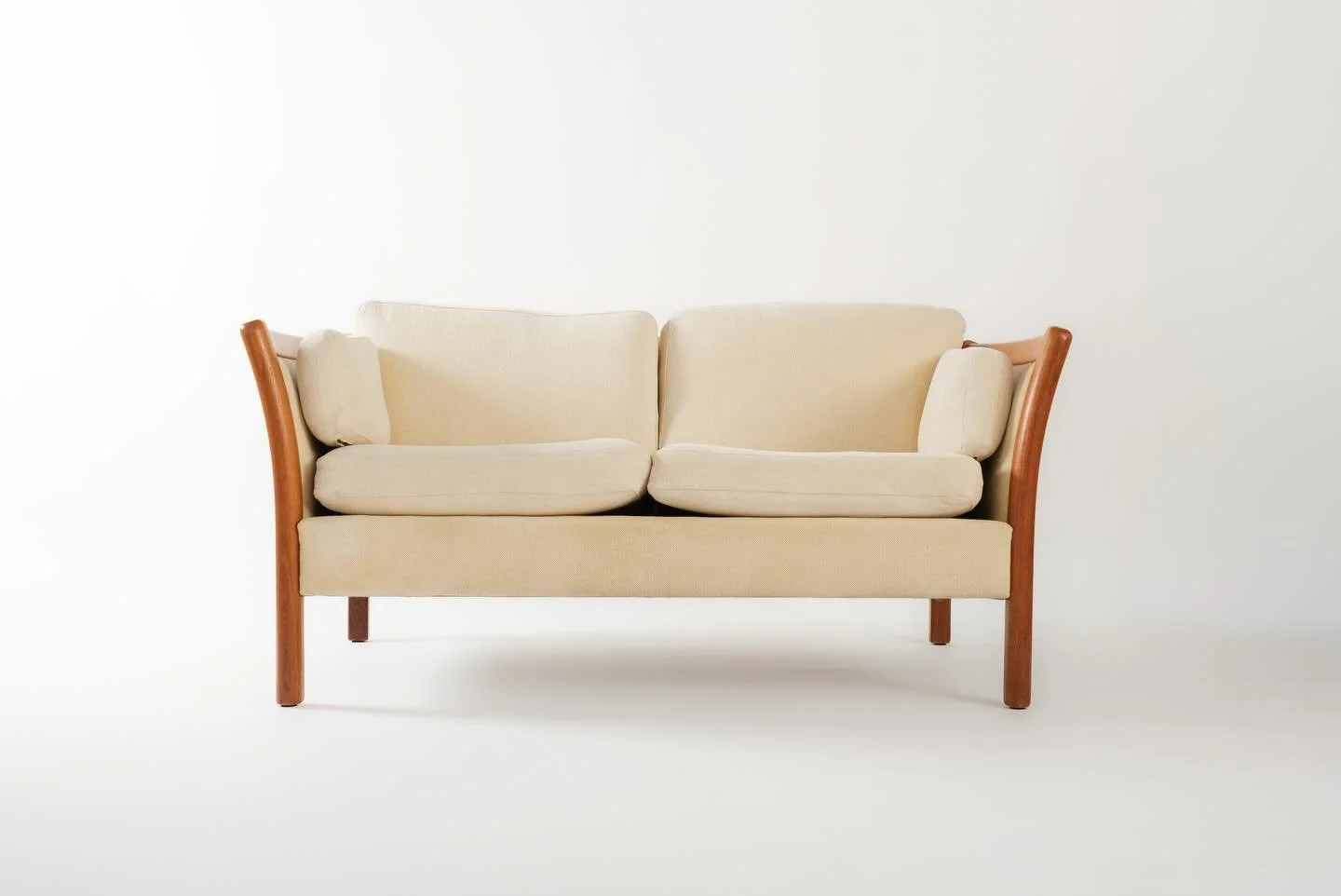 (SOLD) - Danish 2-seater sofa by Stouby. 

A gorgeous Danish modern settee by Stouby, and yes, the original upholstery is still intact. The cream/white fabric has aged beautifully and the beech wood frame is in excellent condition. Six cushions total