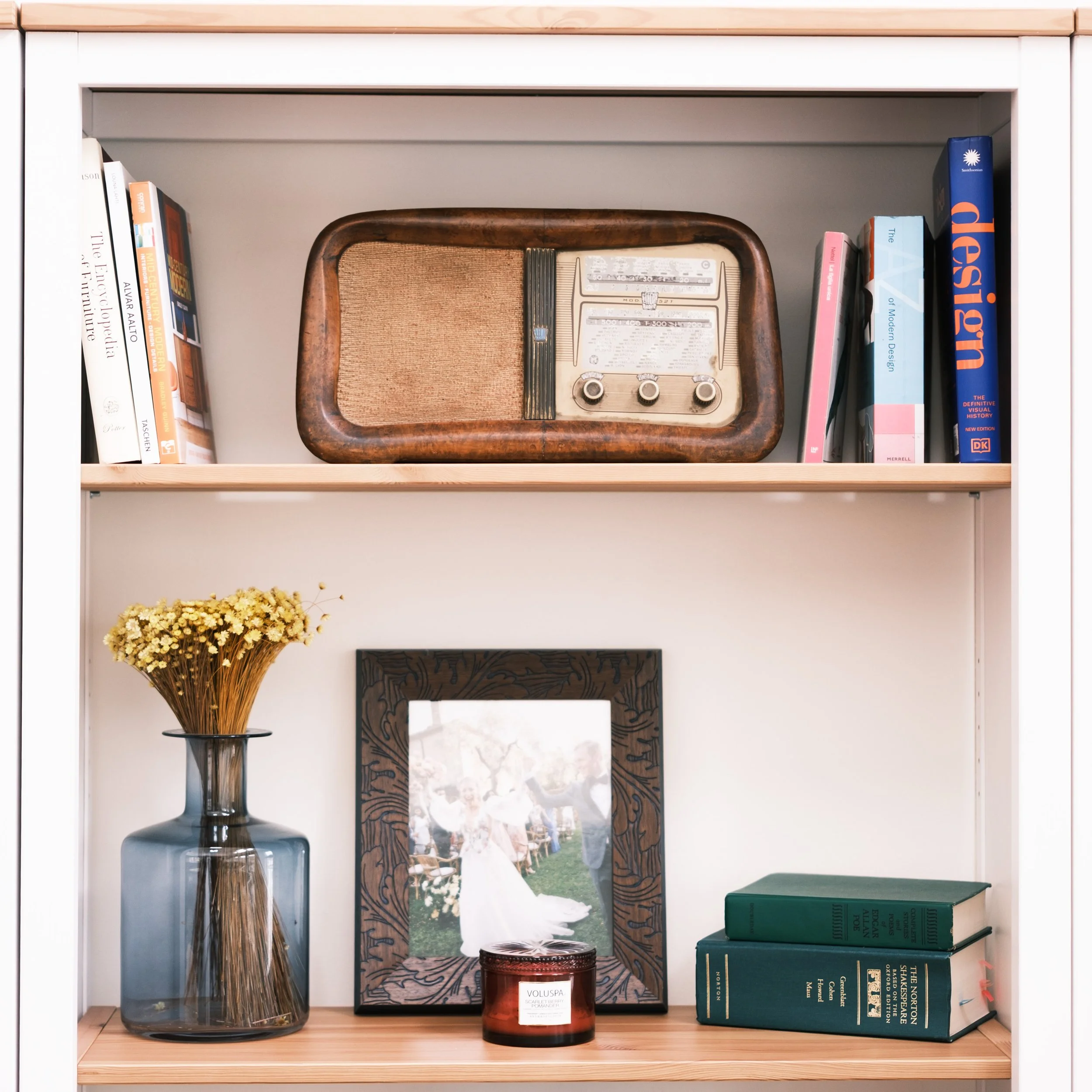 assortment of collected treasures on living room bookshelf