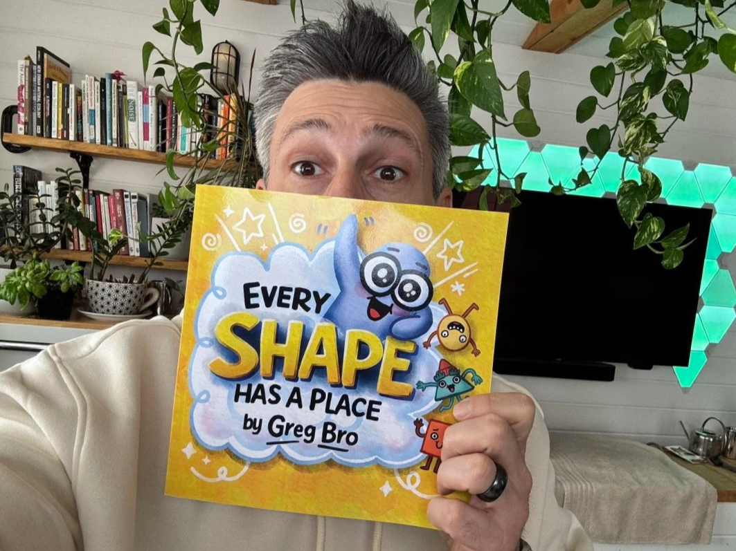 Man holding up a book