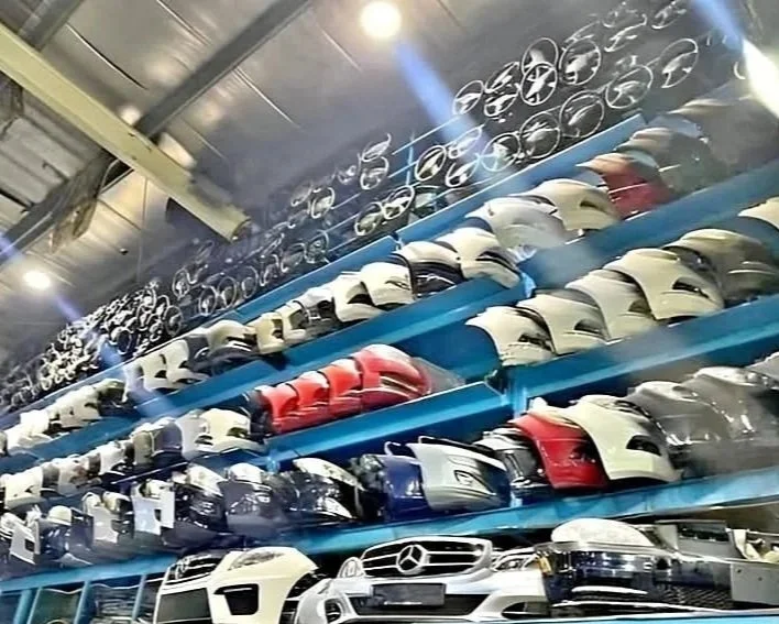 Shelves filled with various car helmets in a store.