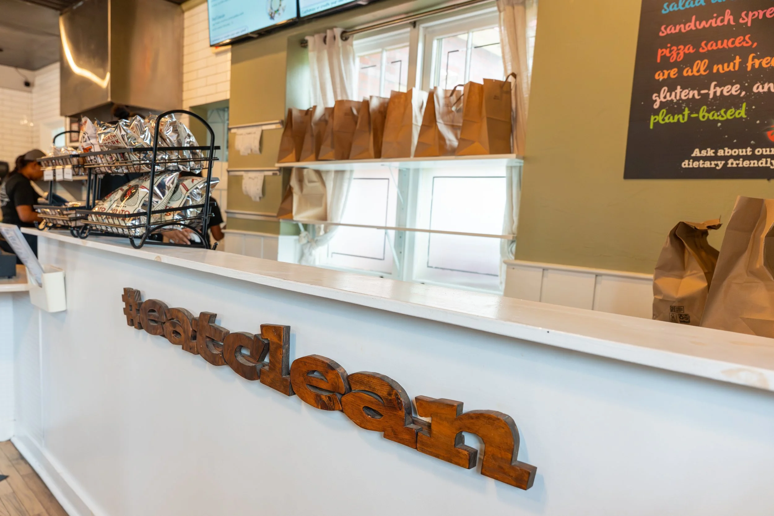 View of a restaurant counter with a wooden 