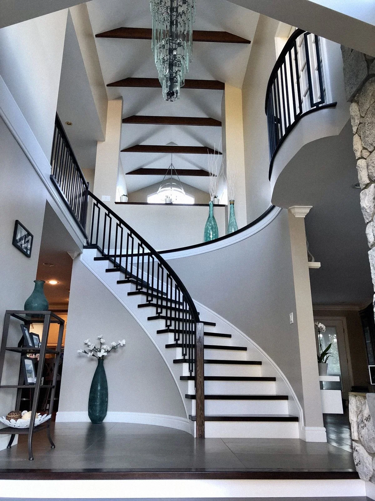 Solid wood curved stair with black railing – Burnaby BC - luxury stairs Burnaby