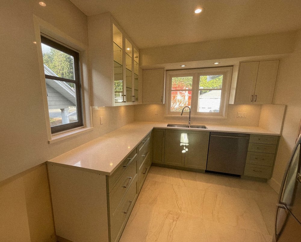 Custom upper kitchen cabinets with glass doors and built-in lighting, North Vancouver millwork project 2