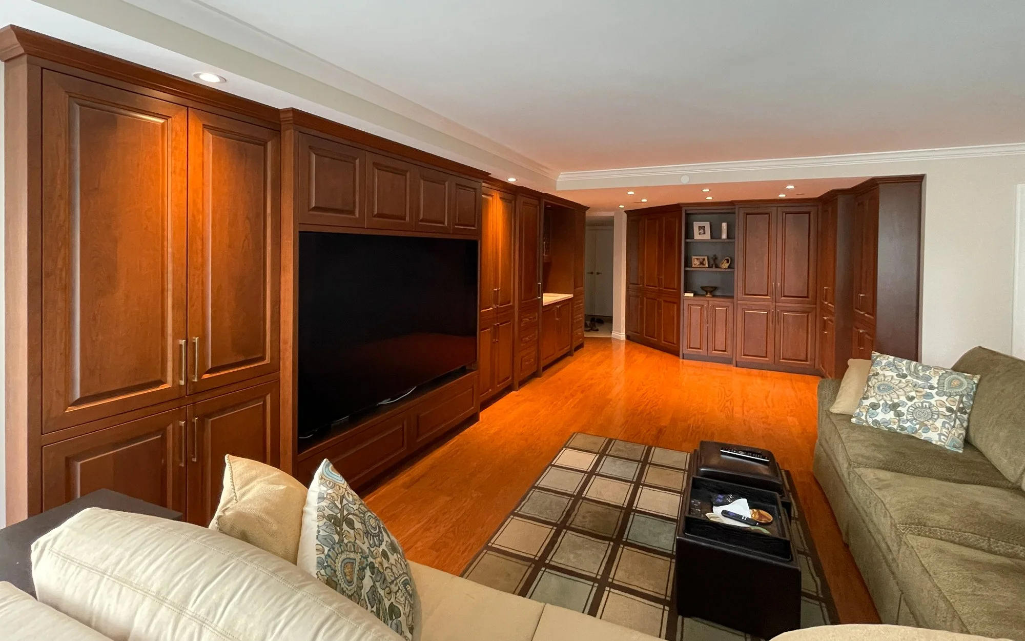 Custom living room built-in wall unit and wood paneling by Alpha Woodcrafts BC