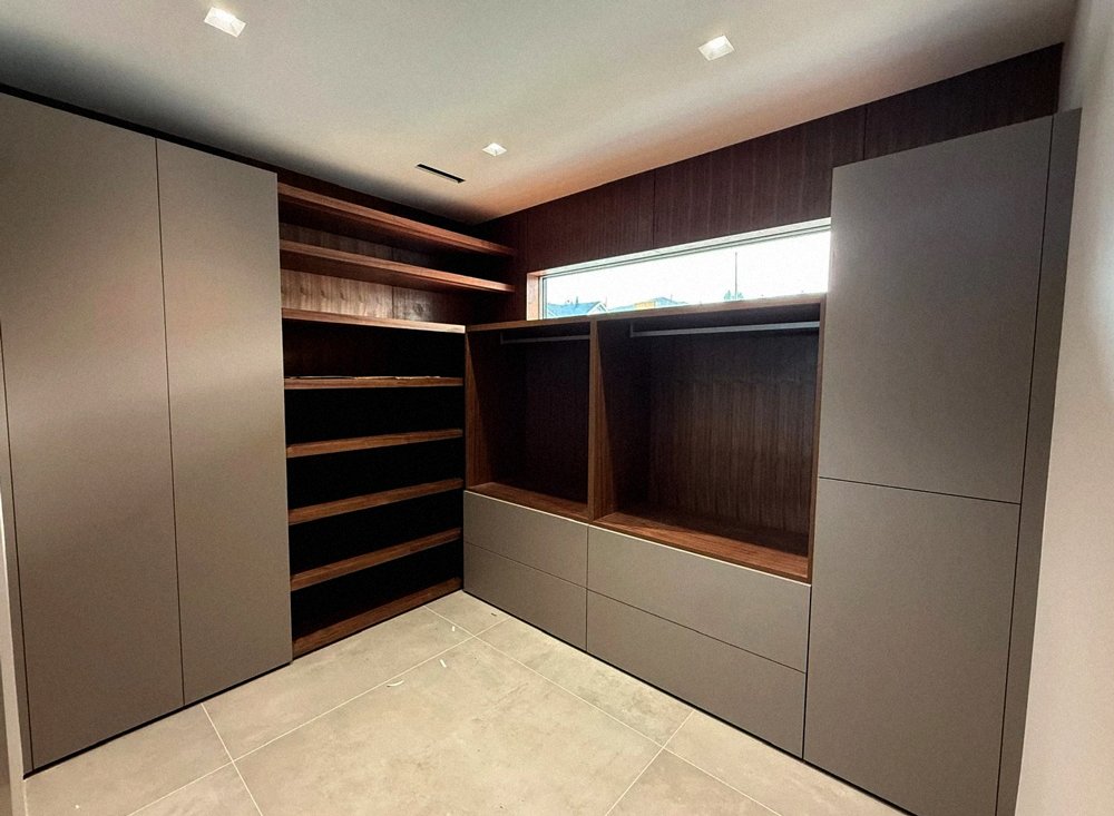 Detail of custom wood bar with integrated storage and seating, high-end millwork Vancouver