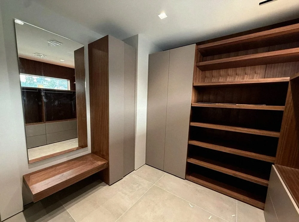 Custom breakfast bar with wood cabinetry and seating area, modern interior millwork Vancouver