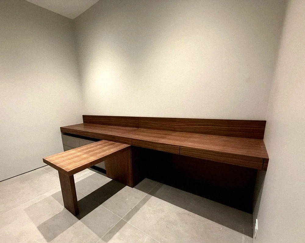 Open-concept kitchen and dining area with custom cabinetry and wood finishes in Vancouver home