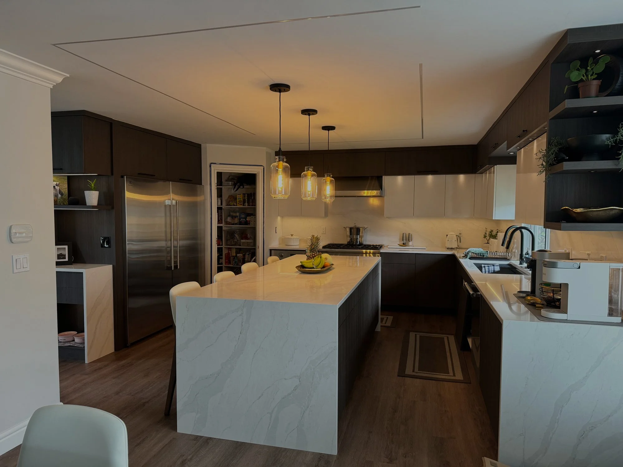 Custom high-end kitchen cabinetry with large stone island by Alpha Woodcrafts BC in Vancouver