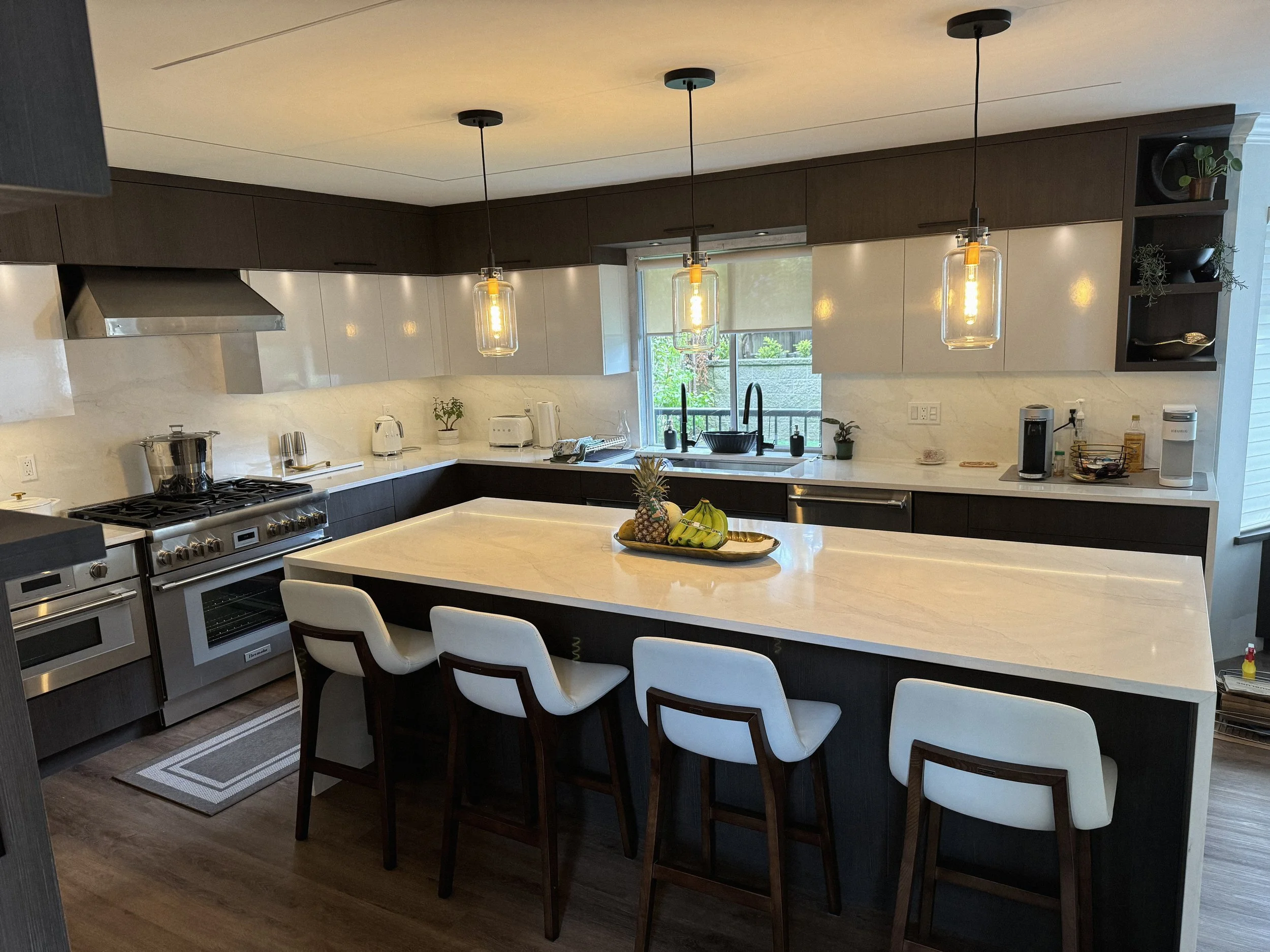 Custom modern kitchen with wood cabinetry and island by Alpha Woodcrafts BC