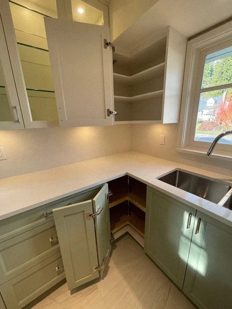 Custom upper kitchen cabinets with glass doors and built-in lighting, North Vancouver millwork project 4