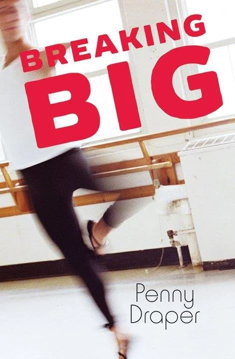 Book cover for "Breaking Big" by Penny Draper, featuring a blurred image of a person stretching or performing an activity in a studio with white walls and wooden ballet bars.