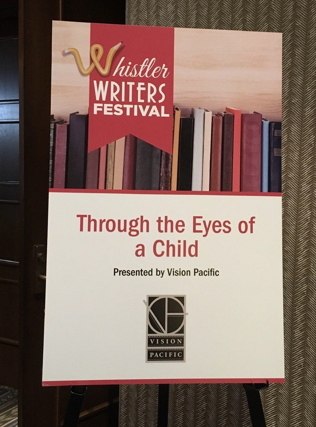 Poster for the Whistler Writers Festival featuring a banner with the festival logo, titled "Through the Eyes of a Child," a seminar by Penny Draper, presented by Vision Pacific, with a background of books.