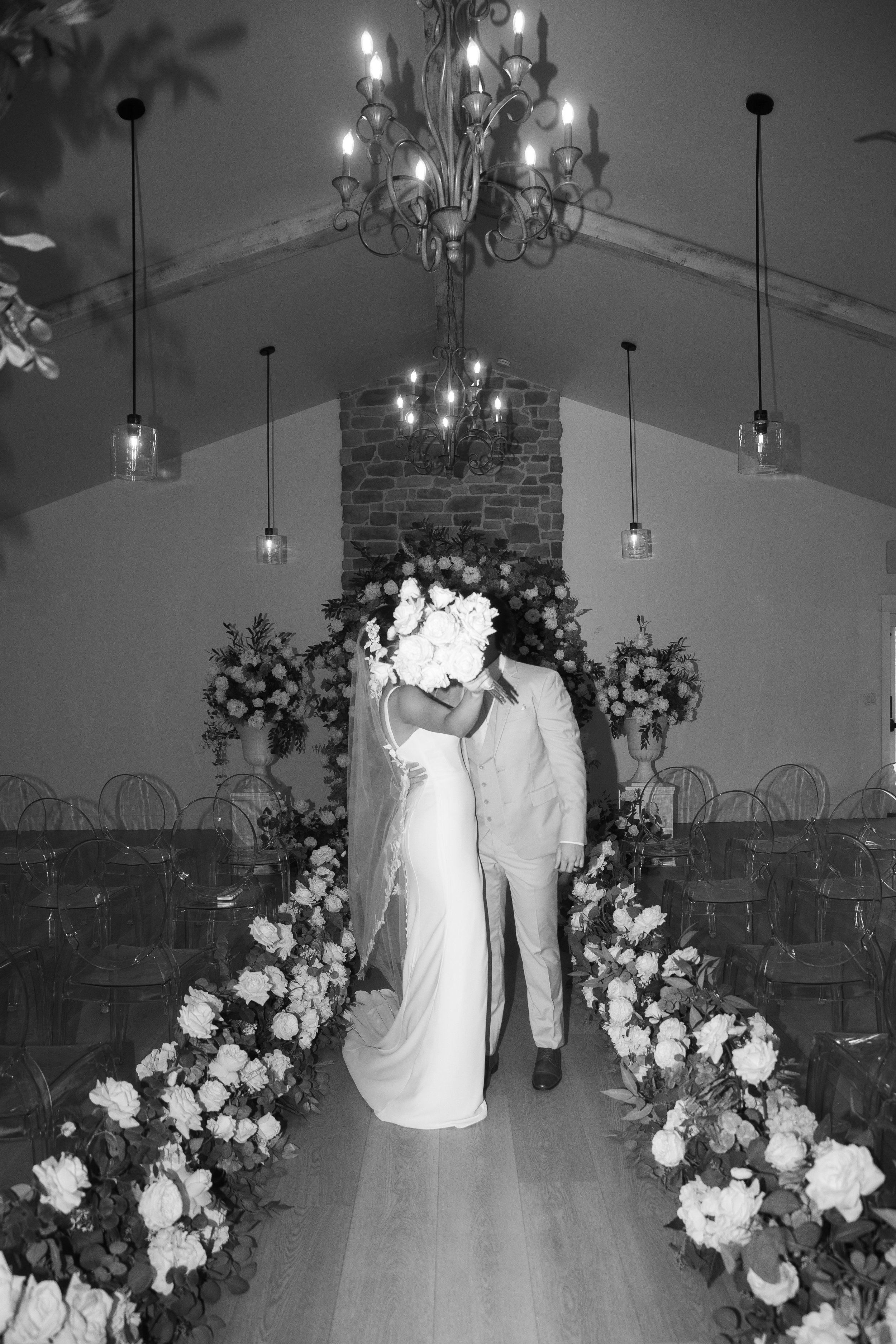Clear Acrylic Ghost Chairs, indoor wedding ceremony, Queen Creek, AZ -  Schnept Farms