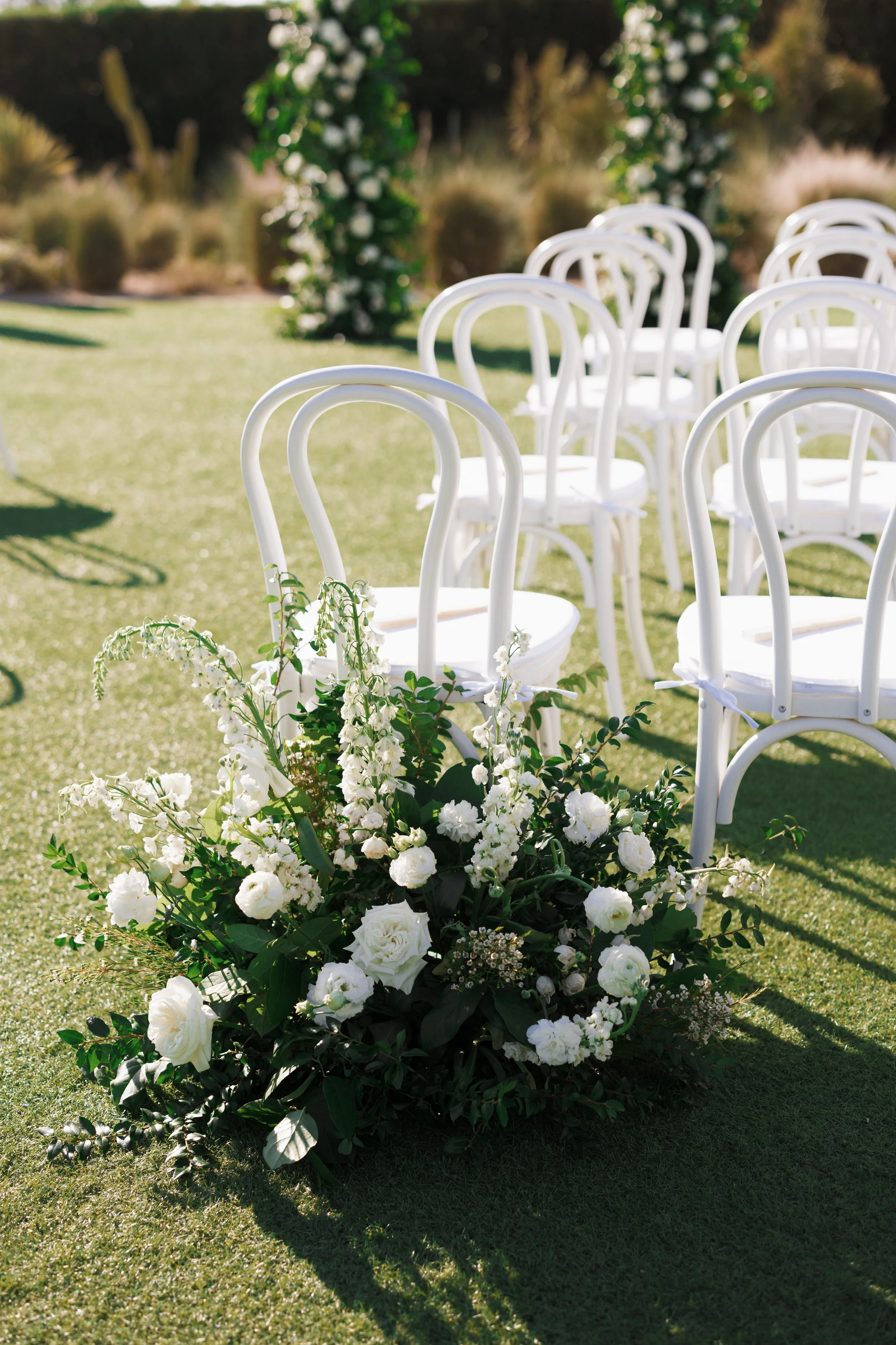 White Bentwood chairs with white cushions set for outdoor garden ceremony, Scottsdale, AZ - Andaz 