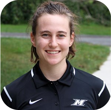 Young woman smiling outdoors wearing a black sports jersey with a logo and Nike swoosh
