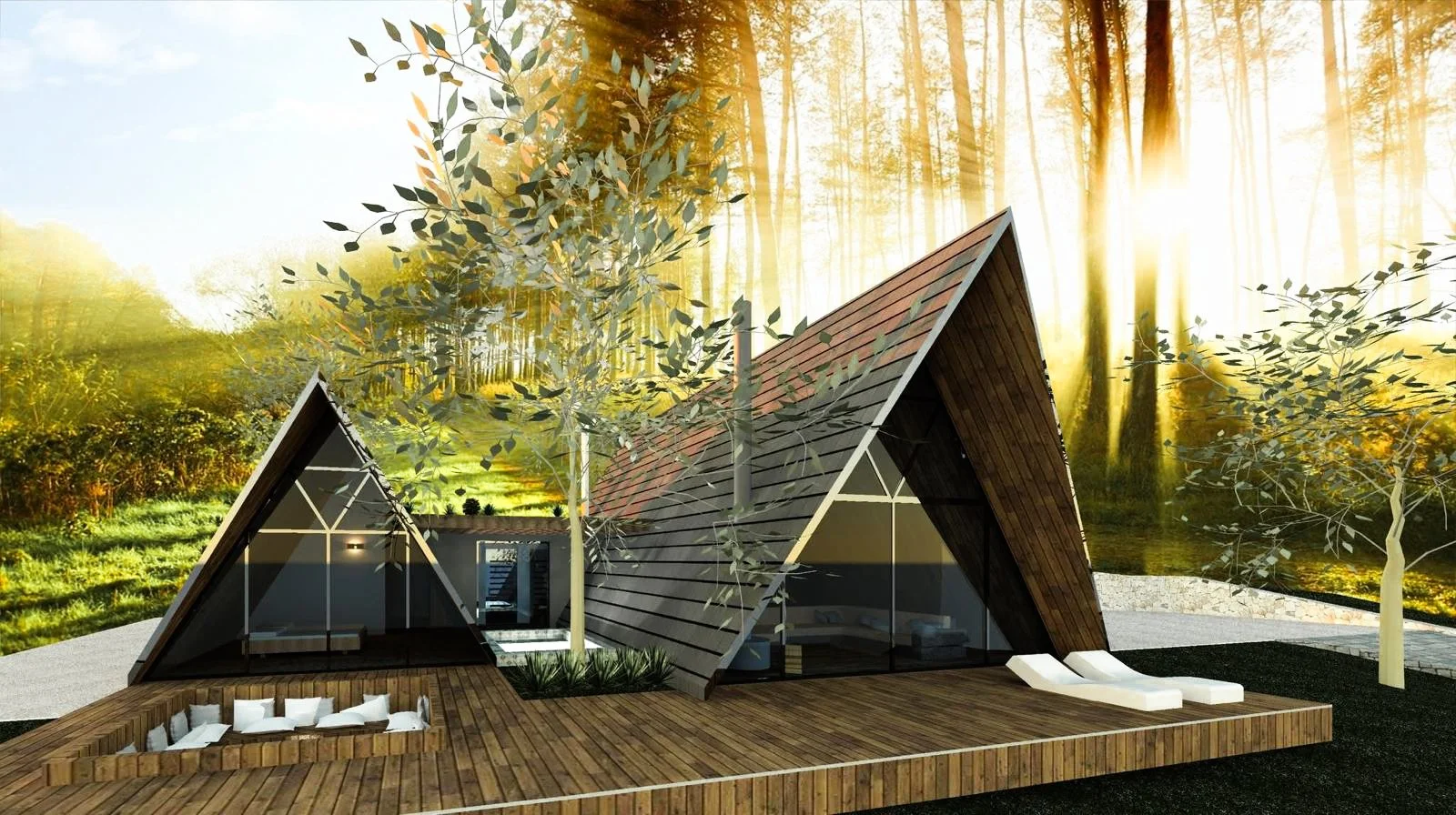 Modern A-frame house with a wooden deck, located in a forested area with trees and sunlight.