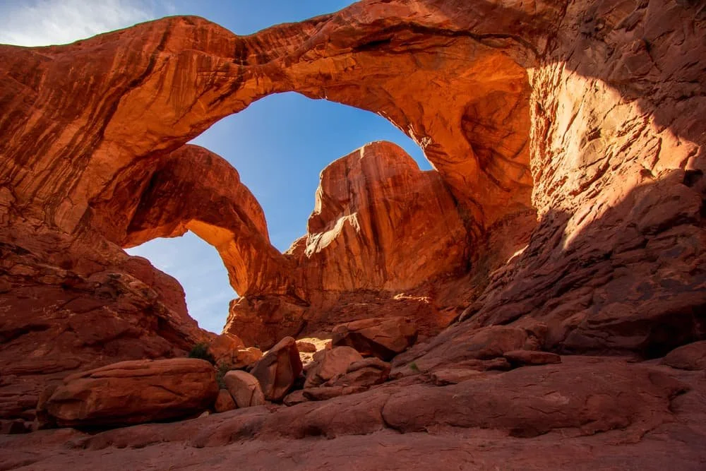 Natural stone arches against a blue sky