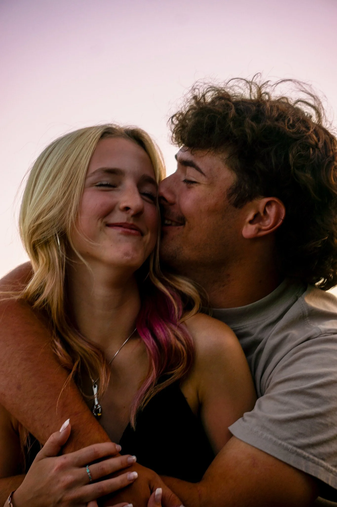 Close up of a couple hugging, smiling, feeling loved