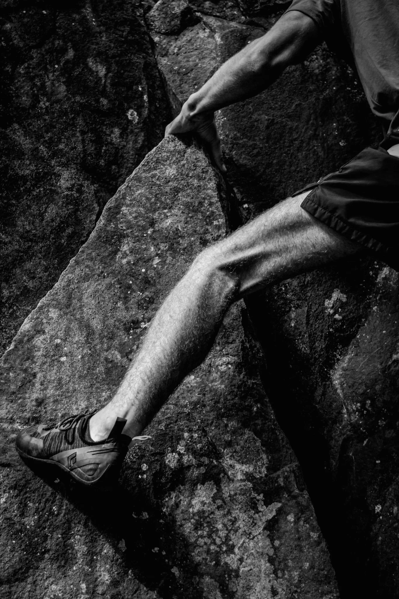 Detail shot of a rock climbers leg muscles