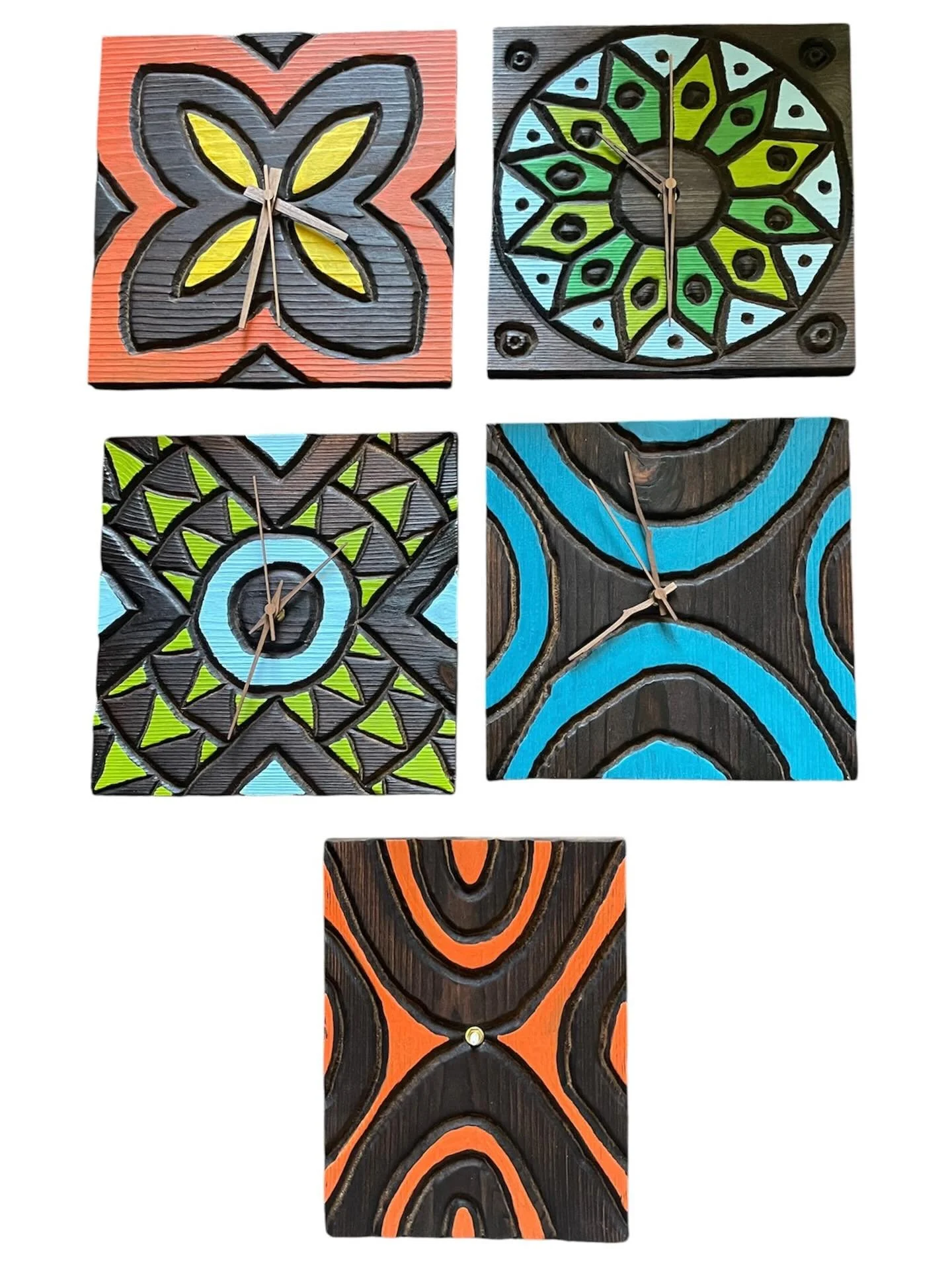 Four square decorative wall clocks with geometric and tribal patterns in bright colors and black outlines.
