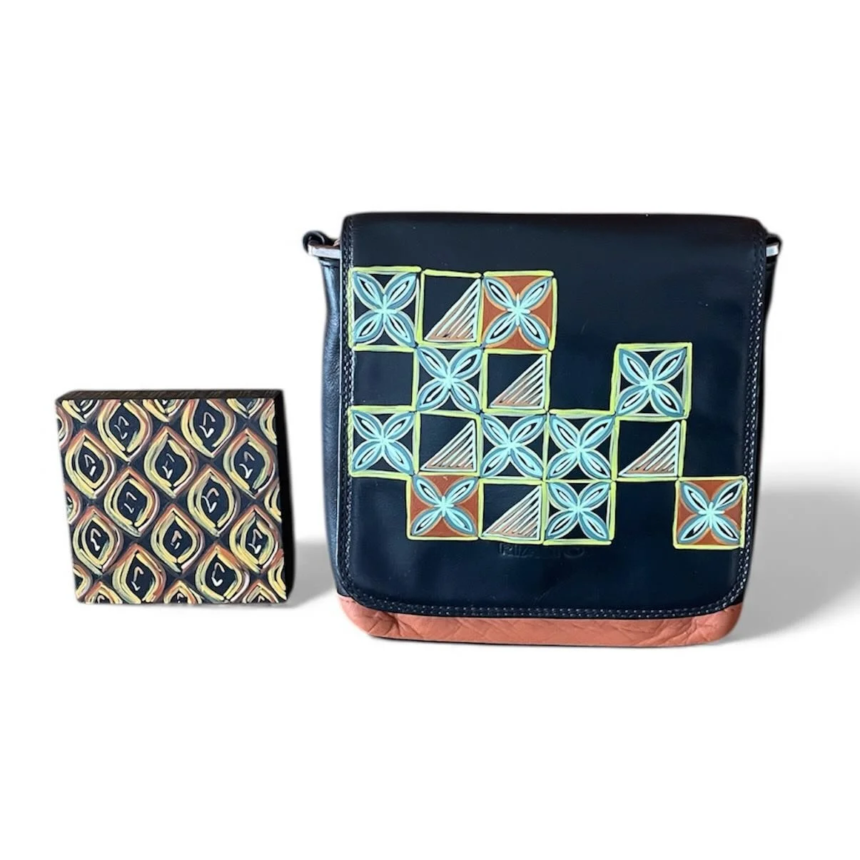 A handbag and a small box, both decorated with geometric patterns and bright colors.
