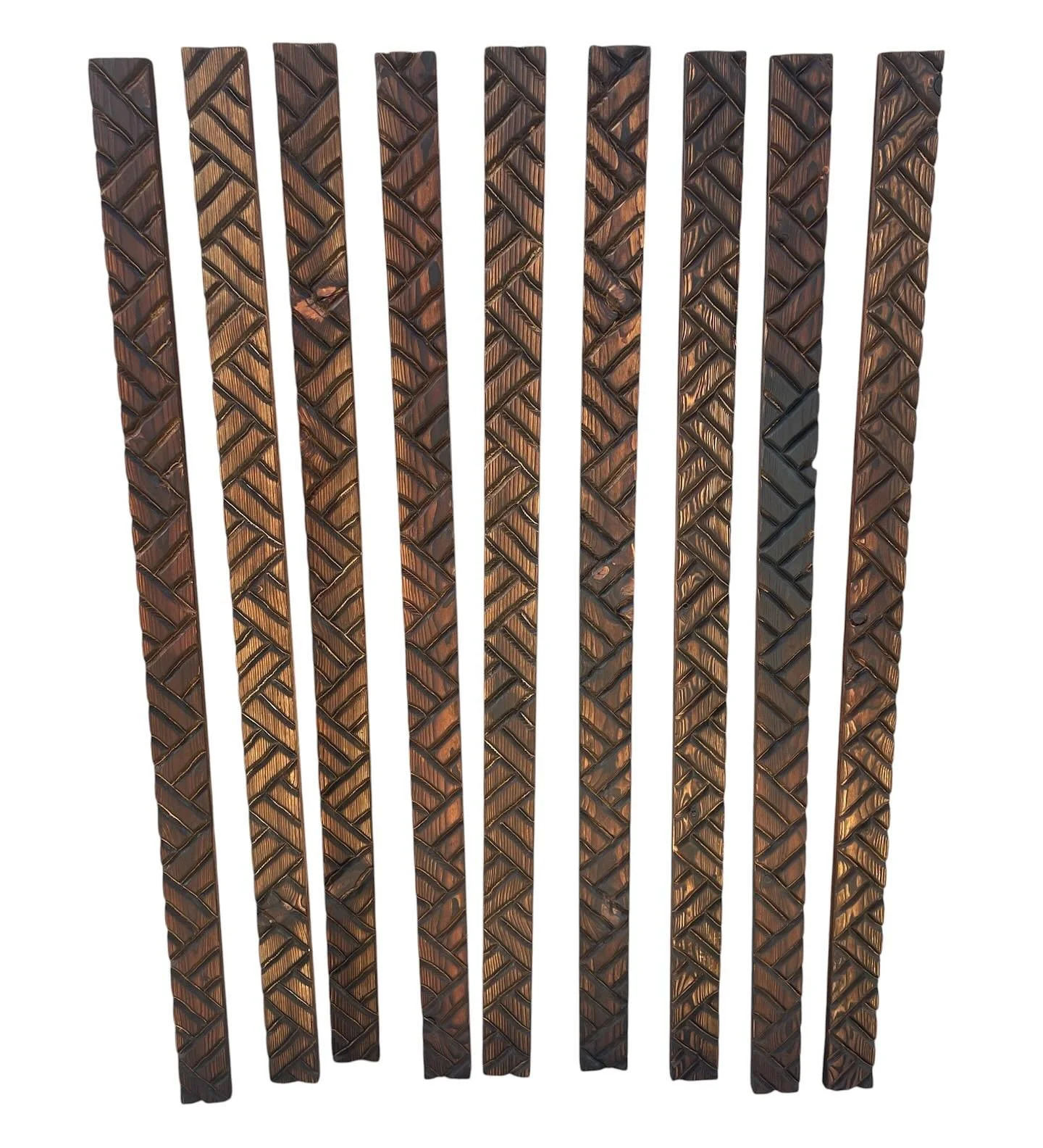 Multiple dark chocolate bars with diagonal textured patterns arranged vertically on a white background.