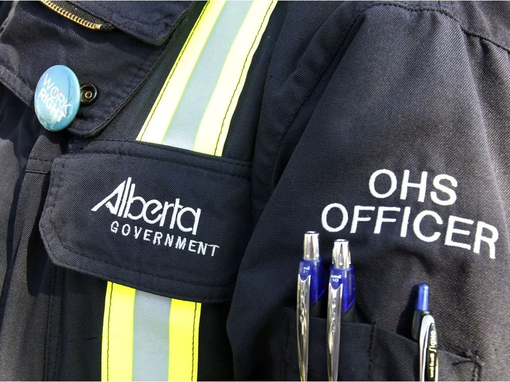 A navy Alberta OHS Safety officer uniform.