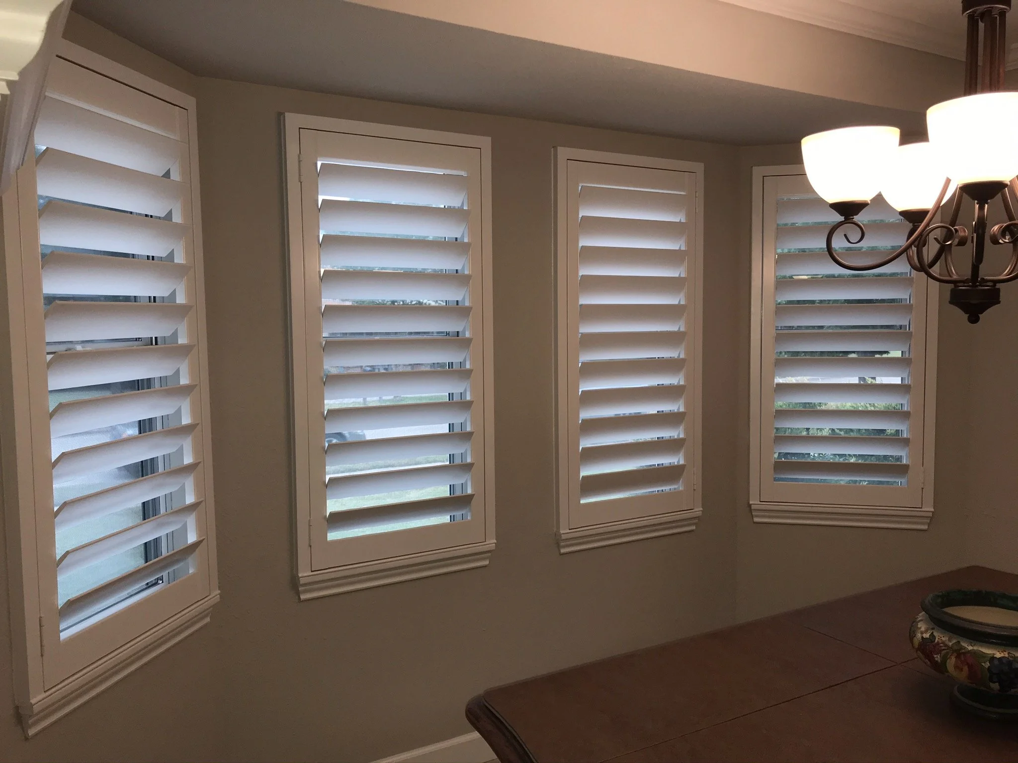 Custom wood plantation shutters with clearview (rear hidden tilt), 4 1/2" louvers, painted SW Pure White semi-gloss, 1.5" flat master frame and Z frame, no splits.  1 panel.