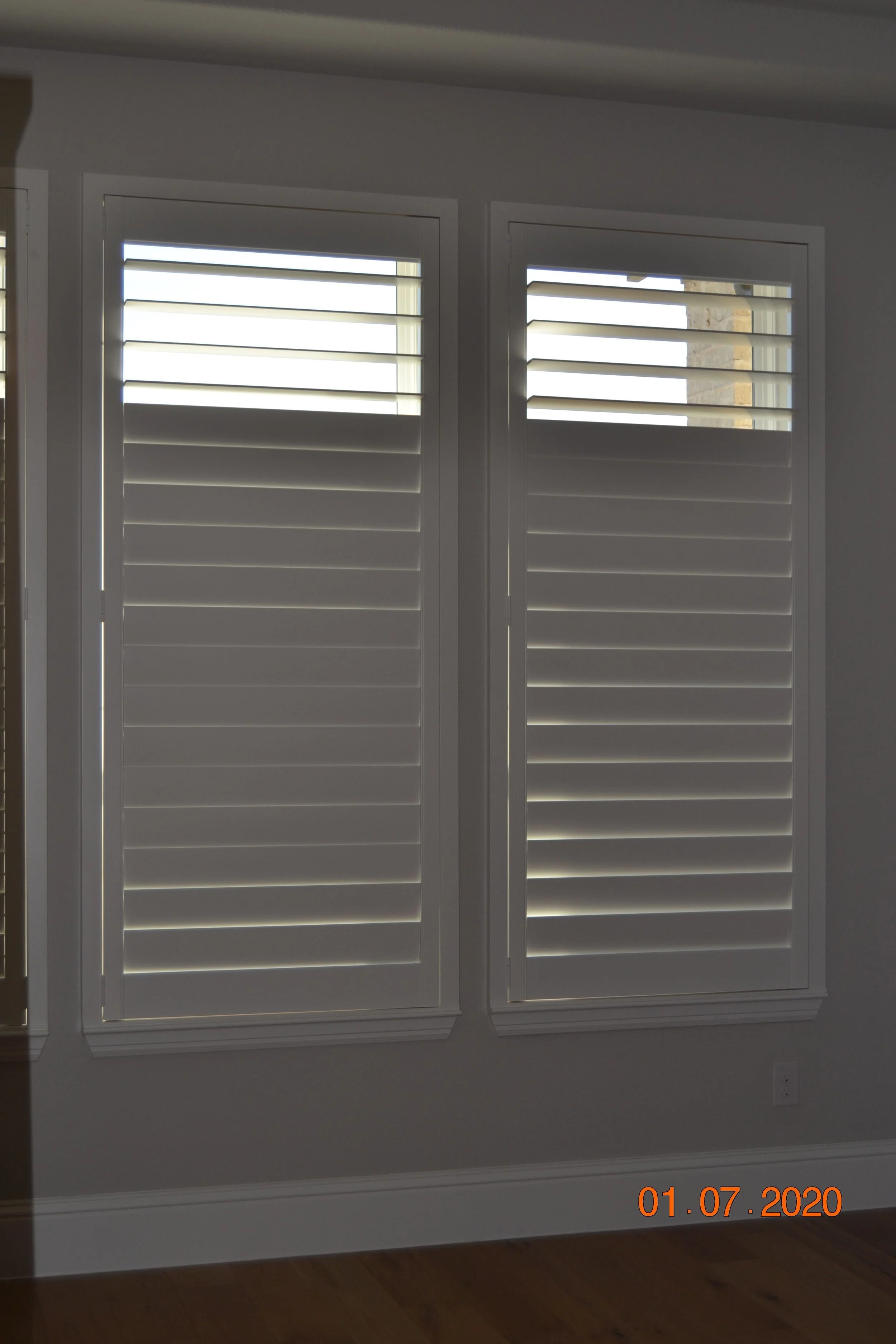 Wood shutters with Clearview (no tilt rod), 4.5" louvers, painted SW 7006 Extra White, flat master frame, split at top to leave 3 or 4 louvers, outside mount.