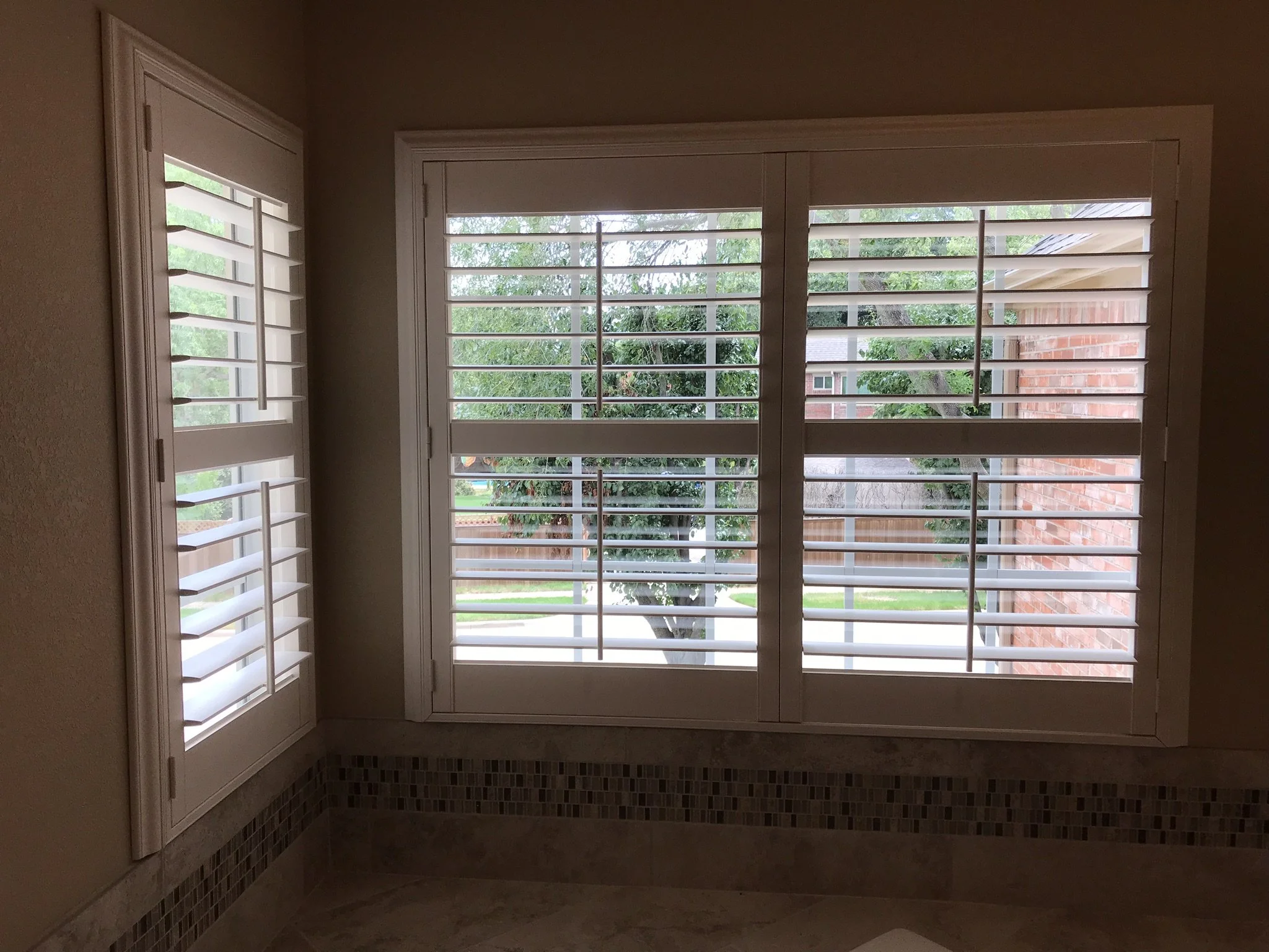 Hunter Douglas Palm Beach Polysatin Vinyl Shutters, 3 1/2" louvers, White Silk, divider rails, front tilt rods, Colonial Z frame, 1 panel and 2 panels, faux shutters.