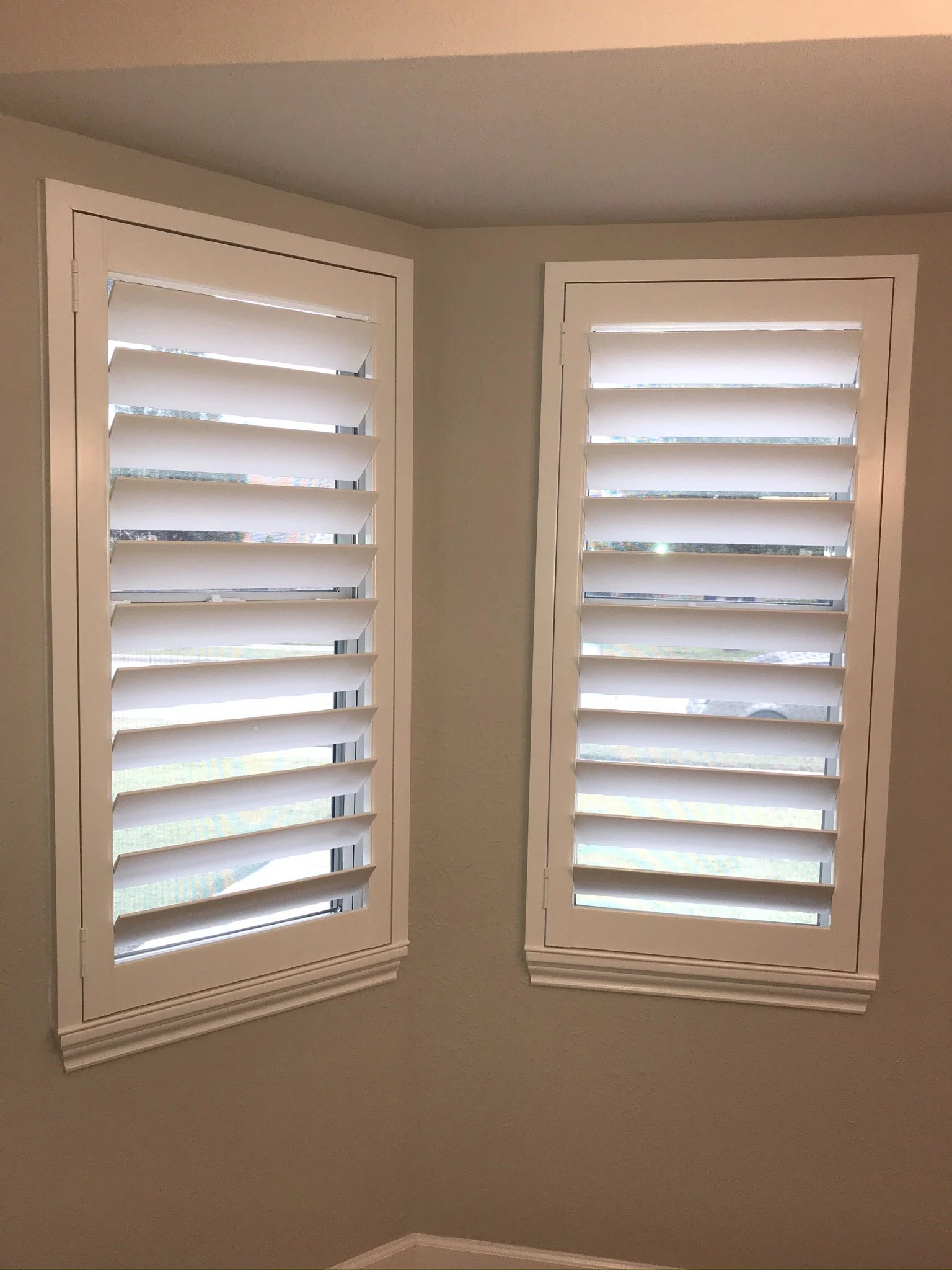 Custom wood plantation shutters with clearview (rear hidden tilt), 4 1/2" louvers, painted SW Pure White semi-gloss, 1.5" flat master frame and Z frame, no splits.  1 panel.