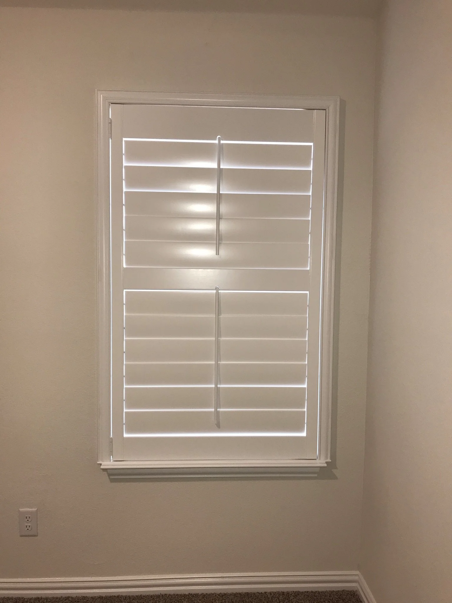 Custom wood shutters with front tilt rods, 4 1/2" louvers, painted, divider rail.