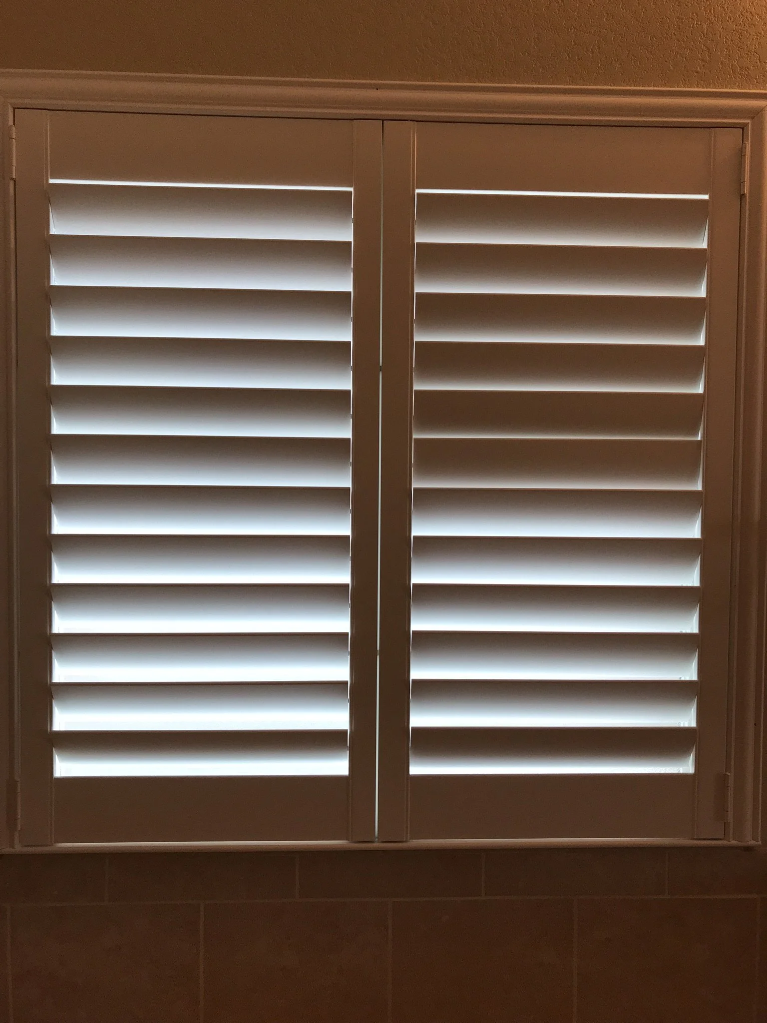 Custom wood shutters with Clearview (no tilt rods), Sherwin Williams Extra White, Belair master and z frame, 3 1/2" louvers, splits @ 50%, 2 panels.