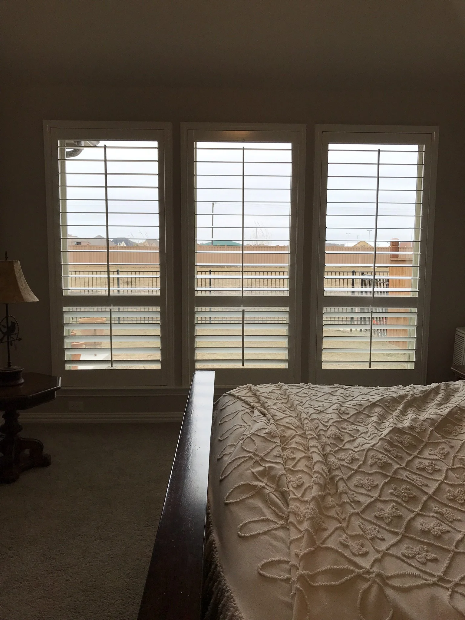 Wood shutters with front tilt rods, 4 1/2" louvers, divider rails @ sash.