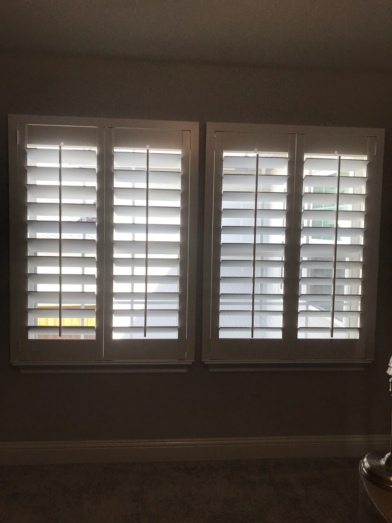 Custom wood shutters with front tilt rods, 4 1/2" louvers, painted, no divider rail.